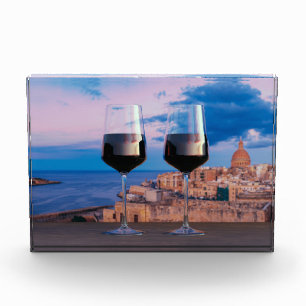 Wine glasses with view of sunset over Valletta Photo Block