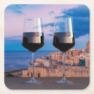 Wine glasses with view of sunset over Valletta Square Paper Coaster