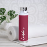 Wine Red Personalised Wedding Bridesmaid Water Bottle<br><div class="desc">Gift your wedding bridesmaid or maid of honour with this trendy, vacuum Insulated water bottle that features her name in white, stylised script on a wine red colour background designed to match your wedding colour scheme. Personalise bottle by editing and replacing name with your own as desired. Select your water...</div>