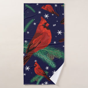 Winter birds - cardinals on fir-tree branches with bath towel