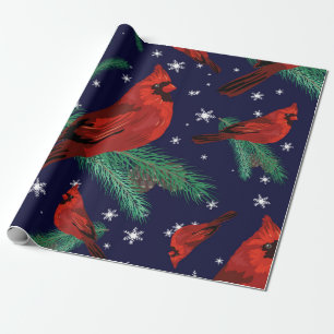 Winter birds - cardinals on fir-tree branches with wrapping paper