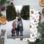 Winter Botanicals Christmas Family Photo Holiday Card<br><div class="desc">Experience the magic of the holiday season with our modern, minimalist Modern One Family Photo Family Christmas Holiday Card. A single, captivating photo space is perfectly balanced by a refreshing botanical pine cone and holly berries botanical pattern on the back. This tastefully simple design captures the warmth of family ties,...</div>