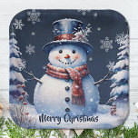 Winter Forest Snowman Christmas | Blue Paper Plate<br><div class="desc">Bring the charm of a winter forest to your holiday gatherings and Christmas parties with this Blue Winter Forest Snowman Paper Plates. These sturdy plates feature a delightful smiling snowman surrounded by snowy pine trees and white snowflakes, with falling snow adding a festive touch. The festive script displaying "Merry Christmas"...</div>