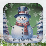 Winter Forest Snowman Christmas | Green Paper Plate<br><div class="desc">Bring the charm of a winter forest to your holiday gatherings and Christmas parties with this Green Winter Forest Snowman Paper Plates. These sturdy plates feature a delightful smiling snowman surrounded by snowy pine trees and white snowflakes, with falling snow adding a festive touch. The festive script displaying "Merry Christmas"...</div>