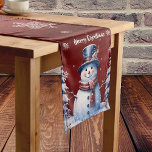 Winter Forest Snowman Christmas | Red Medium Table Runner<br><div class="desc">Add a festive and whimsical touch to your home decor this holiday season with a Red Winter Forest Snowman Christmas Table Runner. Table runner design features a cute snowman in a charming top hat and scarf standing in a winter forest scene with falling snow. Additional holiday home decor available with...</div>