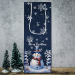 Winter Forest Snowman Christmas Wine Gift Bag<br><div class="desc">Gift a fine bottle of wine this holiday season with a Winter Forest Snowman Christmas Holiday Wine Gift Bag. Gift bag design features a cute snowman in a charming top hat and scarf standing in a winter forest scene with falling snow. Additional gift and holiday items available with this design...</div>