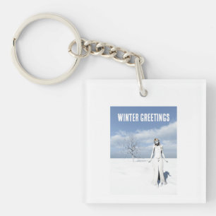 Winter Greetings. Female elf walking in the snow Key Ring
