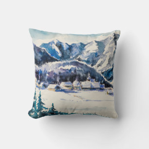 Winter landscape with mountain village covered wit cushion