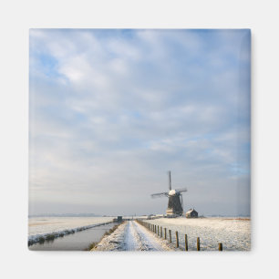 Winter landscape with snow and windmill in Holland Magnet