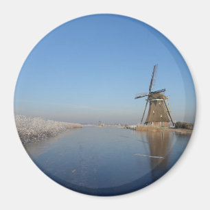 Winter landscape with windmill and ice magnet