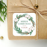 Winter Merry Christmas Watercolor Greenery Wreath Square Sticker<br><div class="desc">This personalised holiday sticker features a watercolor wreath of green and brown winter greenery,  including pine sprigs and cotton. The words "Merry Christmas" appear in green serif font. Personalise the design with your family name below in brown italics.</div>