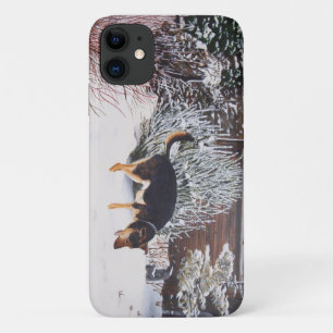Winter snow scene with cute black and tan dog iPhone 11 case