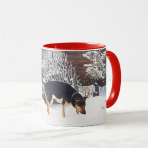 Winter snow scene with cute black and tan dog mug