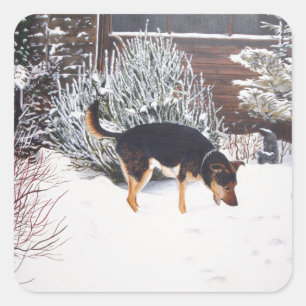Winter snow scene with cute black and tan dog square sticker