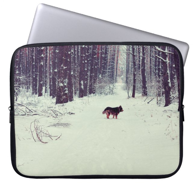Winter snowy pine forest, dog walking in the fores laptop sleeve (Front)