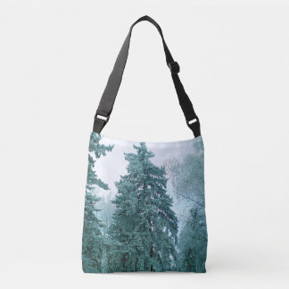Winter spruce tree with snow crossbody bag