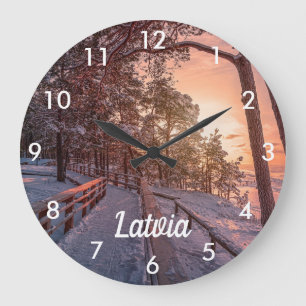 Winter sunset in pine forest near sea large clock