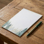 Winter themed green pine trees lined notepad<br><div class="desc">This winter themed green pine trees lined notepad features a beautiful watercolor forest scene with layers of snow dusted evergreens in soft green and blue hues. The elegant, wintry border creates a tranquil atmosphere, perfect for letter writing, note taking, or making to do lists during the holiday season. Its lined...</div>
