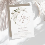 Winter White Floral and Gold Ring Wedding Invitation<br><div class="desc">Winter White Floral and Gold Ring Wedding Invitation. This winter wedding invitation features soft white florals nestled on a minimal gold ring,  set against a taupe backdrop. A refined design ideal for elegant holiday weddings and timeless winter ceremonies. A beautiful blend of romance and modern simplicity.</div>