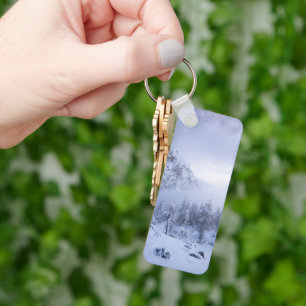 Winter wonderland, fog, spruce forest and mountain key ring