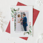 Winterberry and Holly Wedding Christmas Photo Holiday Card<br><div class="desc">Celebrate your first Christmas as a married couple with our customisable photo wedding Christmas card featuring watercolor holly and winterberry. This elegant holiday card design combines the timeless beauty of holly leaves and winterberries with a delicate watercolor effect, creating a festive yet romantic look that’s perfect for newlyweds. Personalise your...</div>