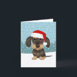 Wirehaired Dachshund Santa Teckel Dog Christmas Holiday Card<br><div class="desc">This adorable Christmas card is perfect for wirehaired dachshund lovers! The hand-drawn image of the festive and loveable teckel wearing a Santa hat captures the playful spirit of the holidays. Customise the inside with your own thoughtful sentiments to help spread joy to everyone on your list this season. Great for...</div>