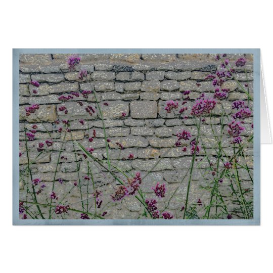 Wispy purple flowers on a rustic brick wall card