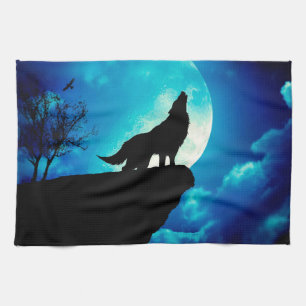 Wolf in silhouette howling to the full moon tea towel
