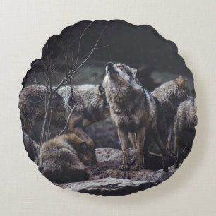 WOLF PACK ON ROCK FORMATION ROUND CUSHION