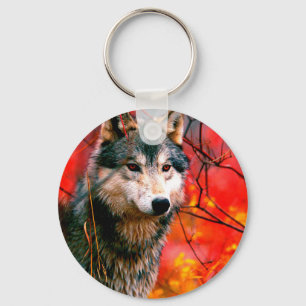 Wolf peeking through leaves in a forest key ring