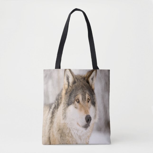 Wolf smiling in snow and winter forest tote bag (Front)