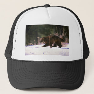 Wolverine running through snow trucker hat