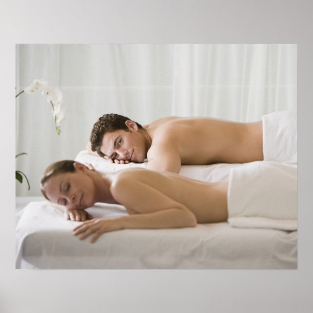 woman and man lying on massage benches poster (Front)