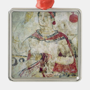 Woman at her toilet, detail from a funerary metal tree decoration