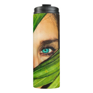 Woman behind green leaves thermal tumbler