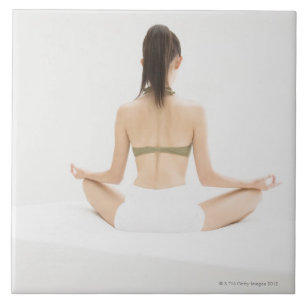 Woman doing yoga tile