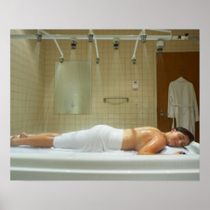Woman enjoying hydrotherapy in vichy shower poster