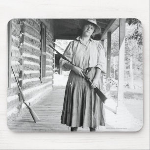 Woman holding a rifle on a porch mouse mat