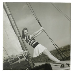 Woman Holding Rigging on Yacht Tile