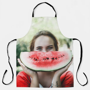 Woman holding sliced watermelon apron