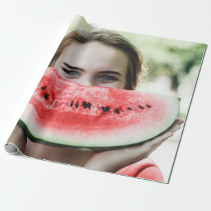 Woman holding sliced watermelon wrapping paper