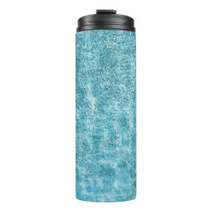 Woman in black bikini bottom and white sun hat sta thermal tumbler