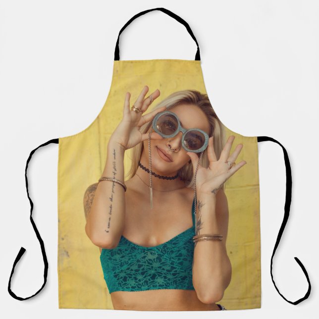 Woman in blue bralette holding sunglasses putting  apron (Front)