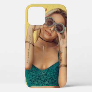 Woman in blue bralette holding sunglasses putting  iPhone 12 case