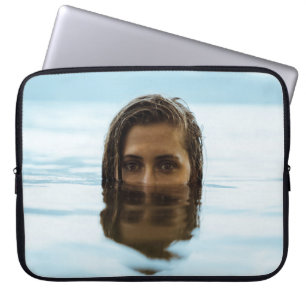 Woman in body of water in the morning laptop sleeve
