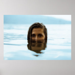 Woman in body of water in the morning poster