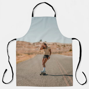 Woman in white shirt running on road in the mornin apron