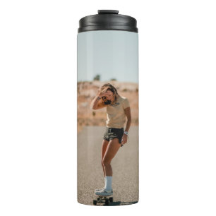 Woman in white shirt running on road in the mornin thermal tumbler