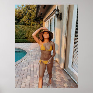 Woman in yellow bikini standing on brown brick flo poster