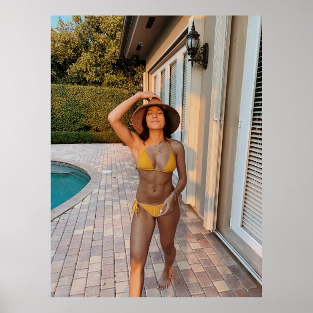Woman in yellow bikini standing on brown brick flo poster (Front)